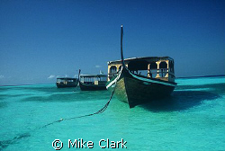Dive boats tied up for the day. by Mike Clark 